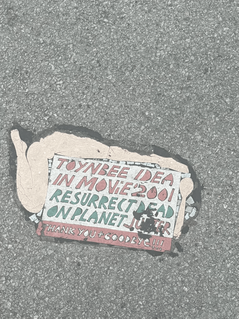 The Toynbee Tiles Mystery: Messages Hidden in the Streets 2 toynbee tile v0 wsecaaf6shhd1